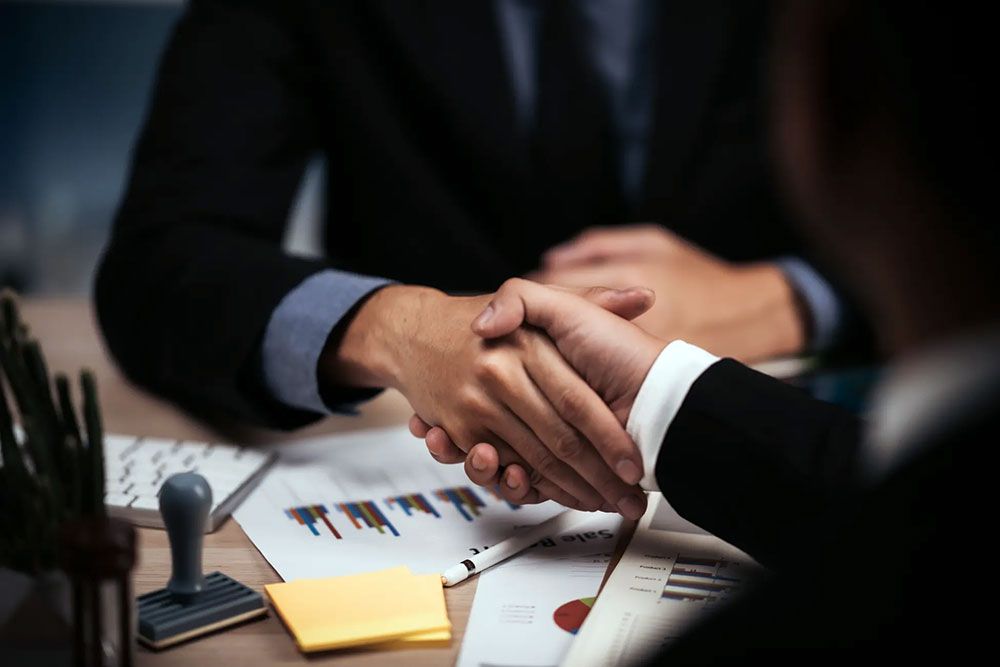 two confident business man shaking hands during meeting office success dealing greeting partner concept